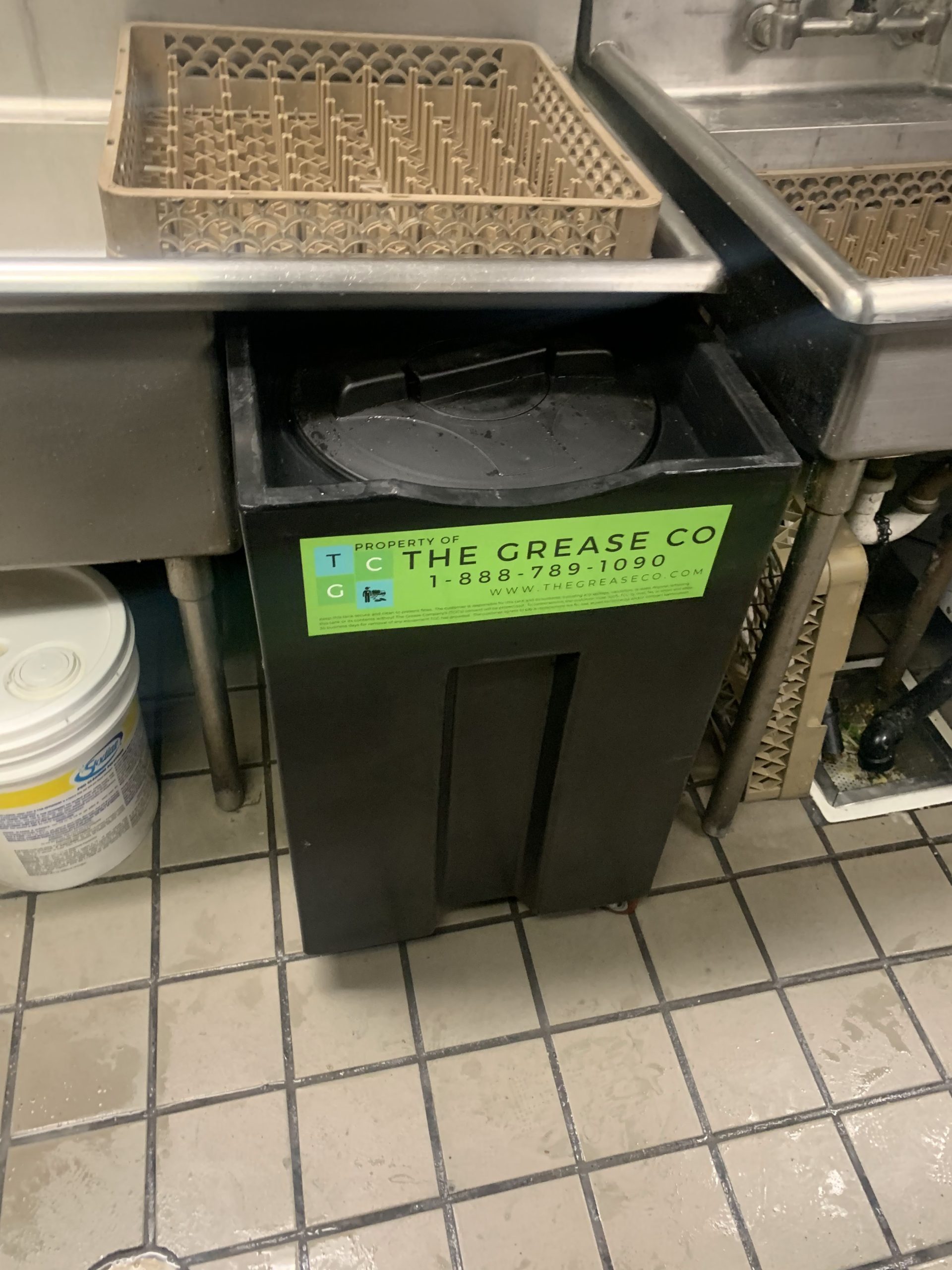 Technician performing grease trap cleaning in Irwindale
