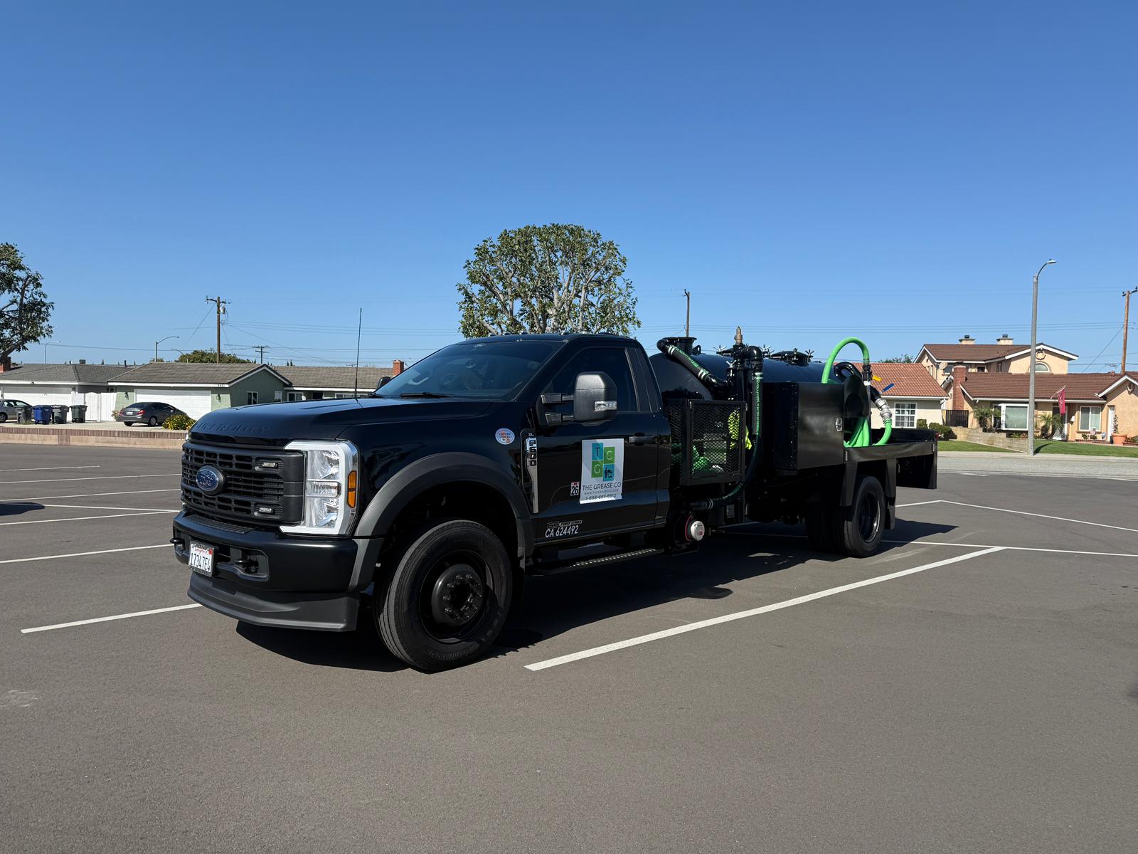 Technician providing grease trap cleaning in Lancaster