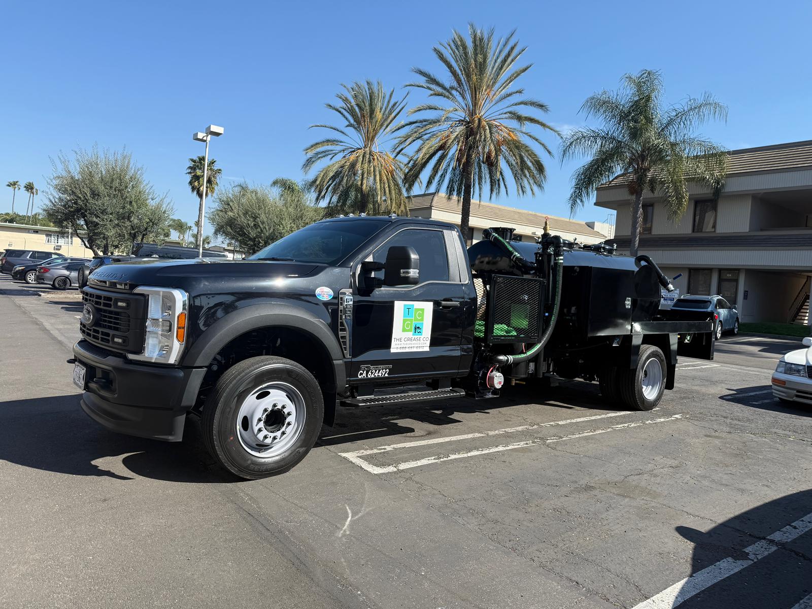 Grease trap cleaning truck servicing a commercial property in Los Angeles